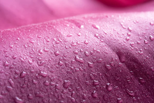 Water drops on pink waterproof fabric,Waterproof coating background