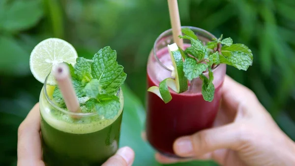 Close Hands Two Glasses Fresh Smoothies Various Fruits Berries Fill Stockfoto