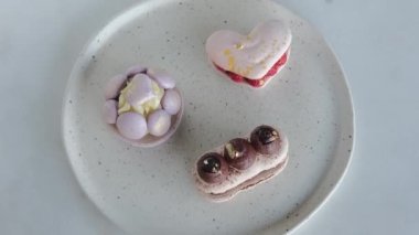 On the dessert plate are laid out amazing confectionery in the form of a variety of fragrant cakes that can be served to guests and taste at a family dinner. Sweet cookies on valentines day.