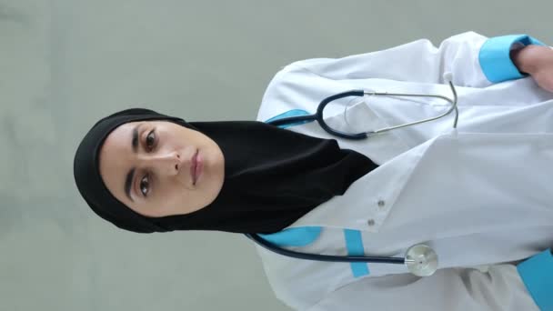 Woman Black Hijab Medical Overalls Stethoscope Her Neck Standing Vertical — Stockvideo