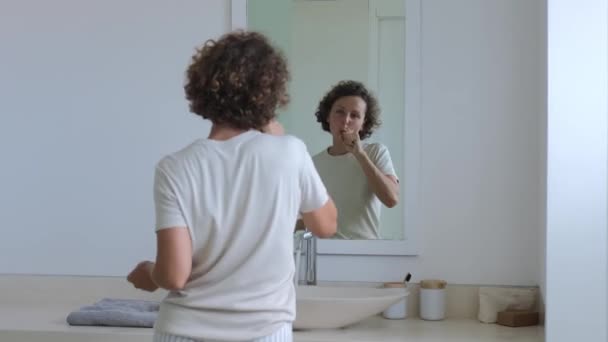 Cheerful Woman Dances Bathroom Front Mirror While Brushing Her Teeth — Stockvideo