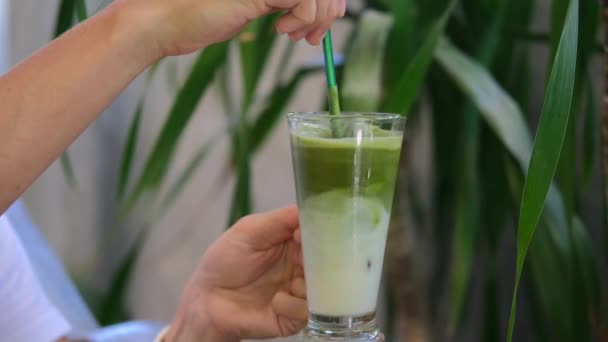 Female Hands Hold Glass Vegetable Almond Milk Cocktail Matcha Tea — Stock Video
