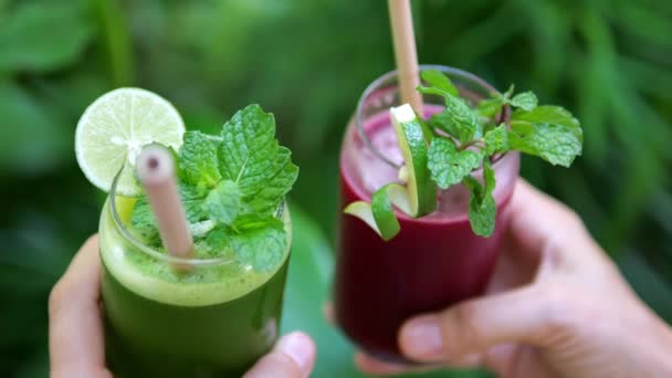 Close Hands Two Glasses Fresh Smoothies Various Fruits Berries Fill — Video