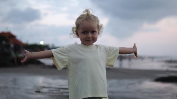 Beautiful Little Girl Stands Open Arms Smiles Sweetly Camera Girl — Vídeo de Stock