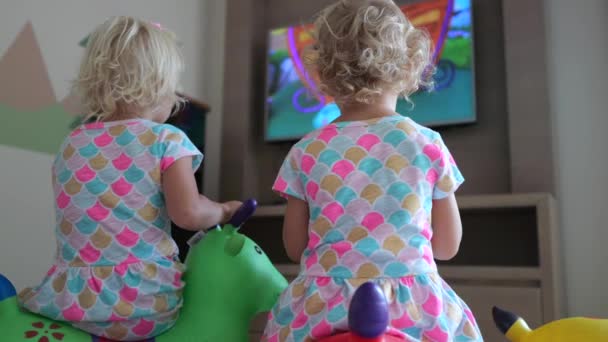 Children Watch Cartoons Playroom Two Blond Girls Sit Soft Pillows — ストック動画