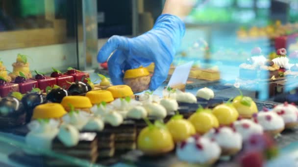 Transparent Showcase Different Types Tastes Cake Hand Disposable Blue Glove — Stockvideo