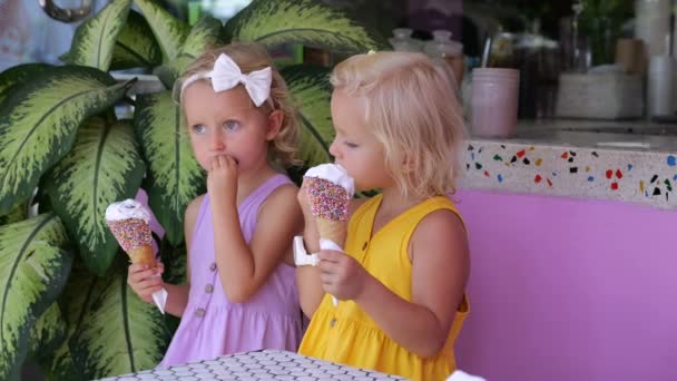 Girls Bright Summer Dresses Eat Ice Cream Cone Twins Enthusiastically — Stock Video