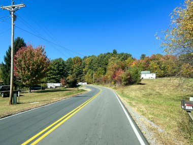 Boone, NC USA - October 23, 2023 - The view from a vehicle of the Blue Ridge Mountains in North Carolina during the Autumn with leave in various colors.