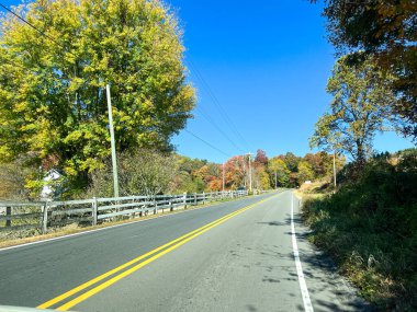 The beautiful view of the changing leaves from a vehicle on the Blue Ridge Parkway.