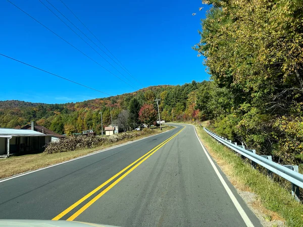 Boone, NC USA - October 23, 2023 - The view from a vehicle of the Blue Ridge Mountains in North Carolina during the Autumn with leave in various colors.