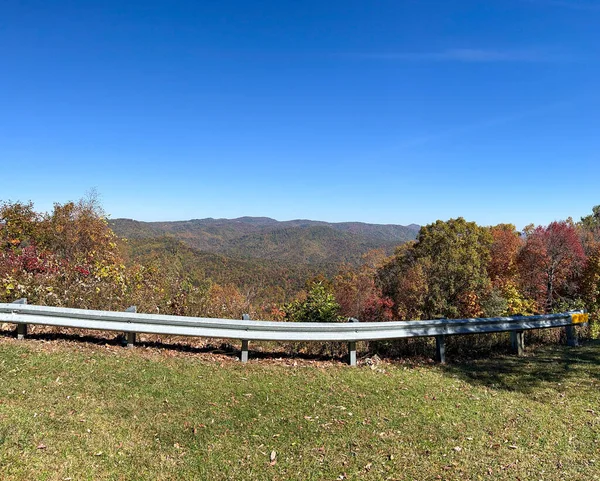 An overlook on the beautiful Blue Ridge Parkway in Boone, NC during the autumn fall color changing season.