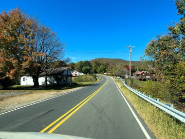 Boone, NC USA - October 23, 2023 - The view from a vehicle of the Blue Ridge Mountains in North Carolina during the Autumn with leave in various colors.
