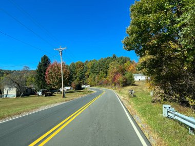 Boone, NC USA - October 23, 2023 - The view from a vehicle of the Blue Ridge Mountains in North Carolina during the Autumn with leave in various colors.