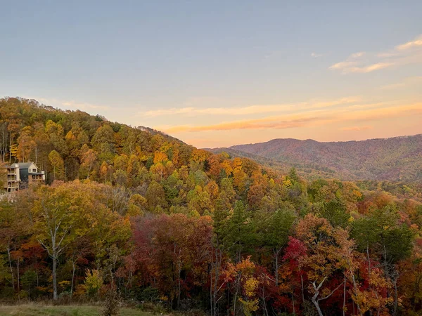 A beautiful view of the Blue Ridge Parkway in Boone, NC during the autumn fall color changing season at sunset.