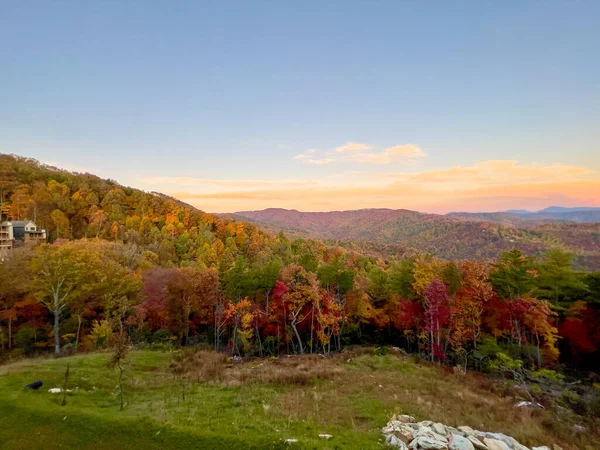 A beautiful view of the Blue Ridge Parkway in Boone, NC during the autumn fall color changing season at sunset.
