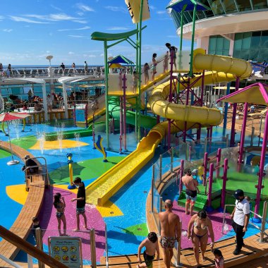 Orlando, FL USA-December 6, 2021:  The family pool area on the Royal Caribbean RCL cruise ship Independence of the Seas in Port Canaveral, Florida. clipart