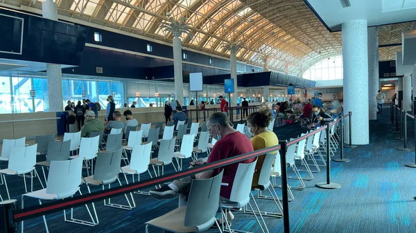 stock image Orlando, FL USA - January 8, 2022:  People waiting to check into a cruise on the Norwegian Cruise Line cruise ship Escape in Orlando, Florida.