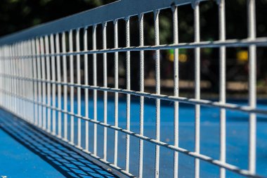 Table Tennis Player serving, motion blur, focus at the ball in the air