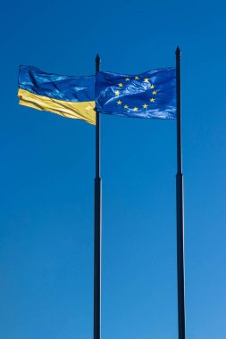 Flag ukraine and european union ukraine candidate in european union The European Commission supported granting Ukraine the status of an EU candidate. Flags of Ukraine and Europe developing against the