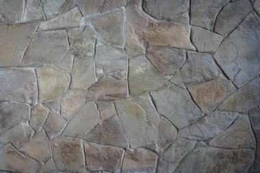 Dekoratif duvarları olan açık kahverengi duvarlar, farklı şekillerde parçalar, duvar kaplaması.