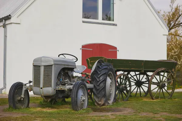 stock image Vintage tractor and cart at the ranch in Denmark.