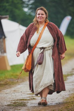 Hojbjerg, Denmark, August, 2022: Woman at a Viking festival. clipart