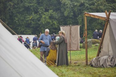 Hojbjerg, Denmark, July 27, 2024: Family at a Viking festival. clipart