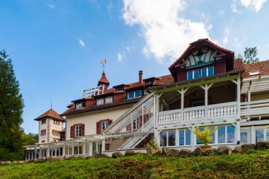 Old hotel in the Vosges mountains. Empty hotel. Construction of the beginning of the 20th century. Curious architecture of a mountain resort.