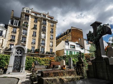 Saint-Vensant cemetery in Paris near Montmartre. Beautiful monuments of famous people. clipart