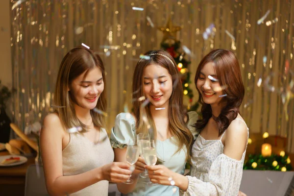 New Year party concept, Young beautiful group clinking champagne to celebrating with fun in party.