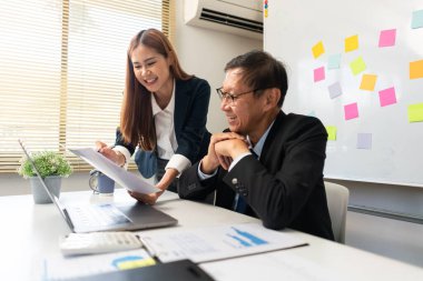 Business partnership concept, Businesswoman pointing at document to presenting project to senior.