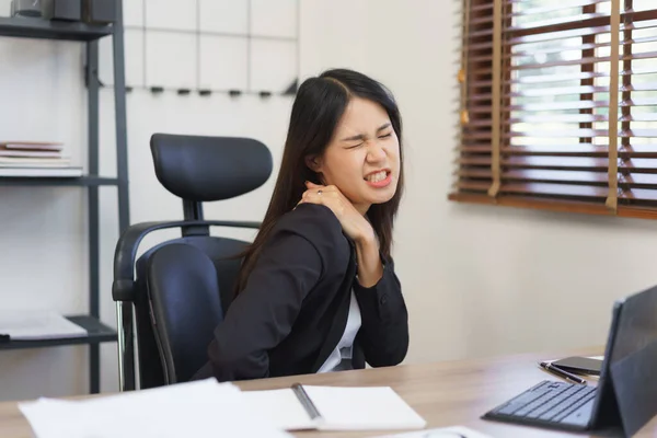 Secretary concept, Female secretary feeling shoulder pain from office syndrome after overworked.
