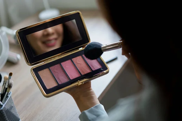 stock image Beauty blogger use brush with blush on to applying product for reviewing cosmetic in makeup vlogger.