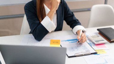 Concept of modern girl leadership, Businesswoman reading data on document and thinking new startup.