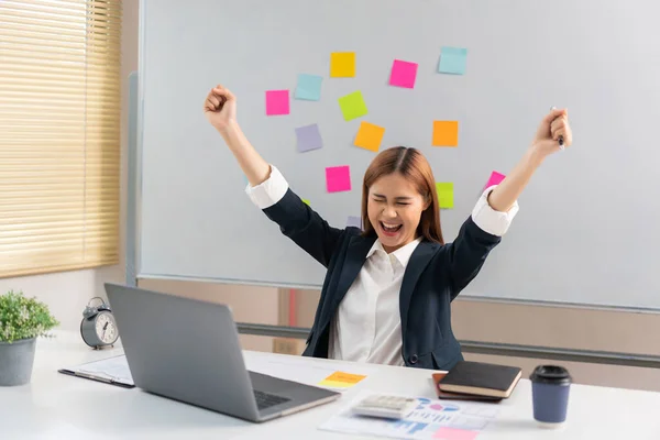 stock image Concept of modern girl leadership, Businesswoman raises her arms in happiness after successful work.