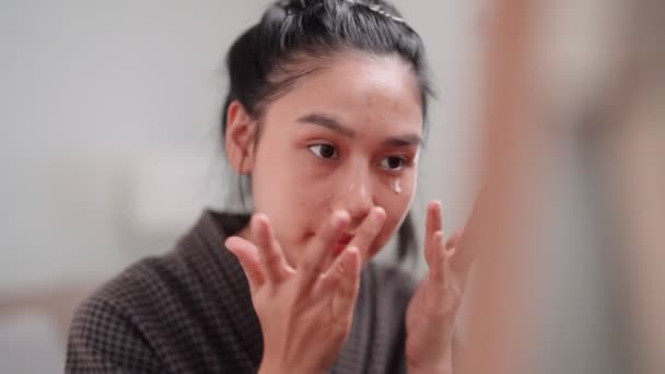 Asian Woman Applying Face Cream Nourish Her Skin Front Large — Video