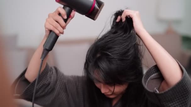 Asian Woman Blow Drying Her Hair Front Large Mirror Washing — Video