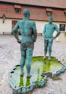 The bronze Piss statue by David Cerny, in front of Franz Kafka Museum in Prague, capital of Czech Republic, on 11 July 2024 clipart