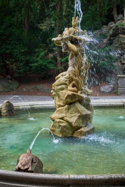 Statue of Neptune and Grotta fountain in Grebovka Havlickovy sady gardens in Vinohrady district in Prague, capital of Czech Republic on 25 July 2024 clipart