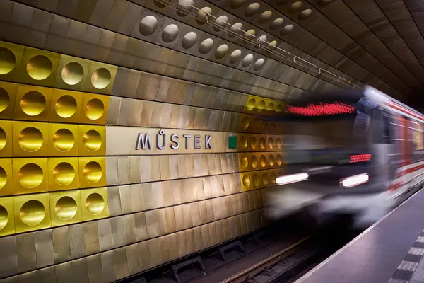 stock image Train arives at Mustek metro station decorated with modern coloured aluminium panels, in Prague, capital of Czech Republic