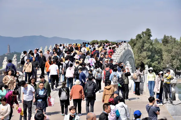 stock image Tourists visiting the Summer Palace, complex of gardens and palaces in Beijing, capital of China on 20 April 2024