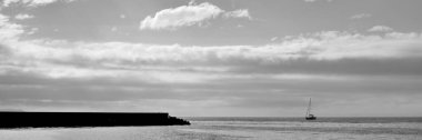 Panoramic black and white image, view of the Osaka Bay during sunset at Marble beach in Tajiri-cho, Izumisano, Osaka Prefecture of Japan clipart