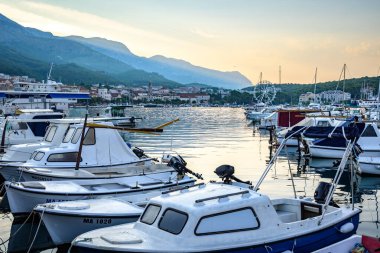 Sunrise over port of Makarska town, popular tourist seaside resort on the Adriatic sea coastline of Croatia on 25 August 2024 clipart