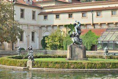 Waldstein Garden and baroque Wallenstein Palace that houses the Senate of the Czech Republic, in Mala Strana, Prague, Czechia clipart