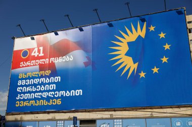 Huge banner promoting Georgian Dream  Democratic Georgia ruling political party, ahead of general parliamentary elections in Tbilisi, capital of Georgia on 16 October 2024 clipart