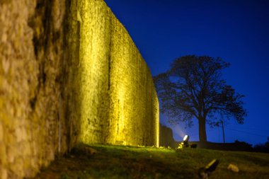 Remains of Historic Belgrade Fortress fortifications in Kalemegdan park at night in Belgrade, capital of Serbia clipart