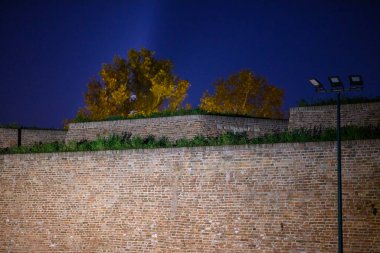 Remains of Historic Belgrade Fortress fortifications in Kalemegdan park at night in Belgrade, capital of Serbia clipart