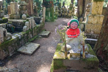 Buddhist monuments in the Okunoin cemetery in Mount Koya, UNESCO world heritage site and a 1200 years old center of Japanese sect of of Shingon Buddhism in Koyasan, Wakayama, Japan on 29 April 2018 clipart