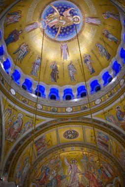 Ornate interior of the Church of Saint Sava decorated with frescoes and golden mosaics, Serbian Orthodox church in Belgrade, Serbia on 7 December 2024 clipart