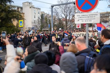 Serbian students and citizens protest against government corruption after Novi Sad railway station accident, in Slavija square in Belgrade, Serbia on 22 December 2024 clipart